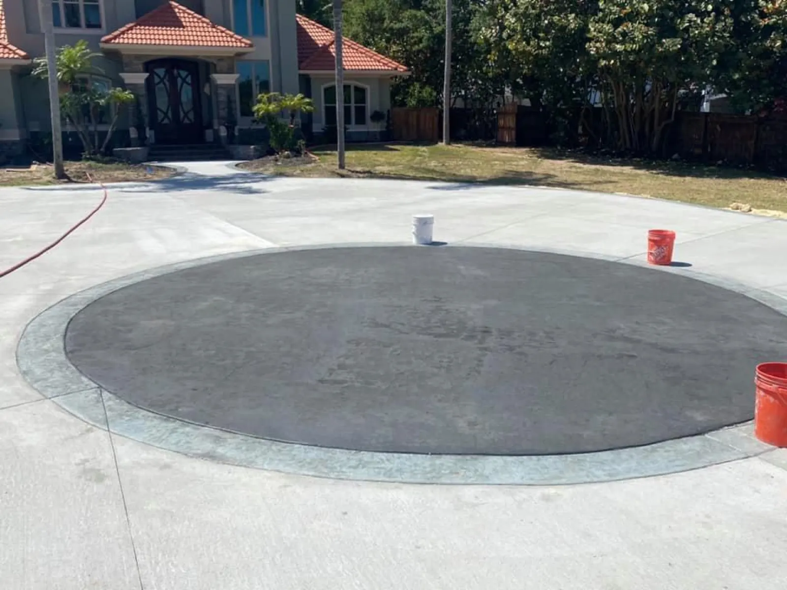 Concrete driveway pour with a circle inlay in progress