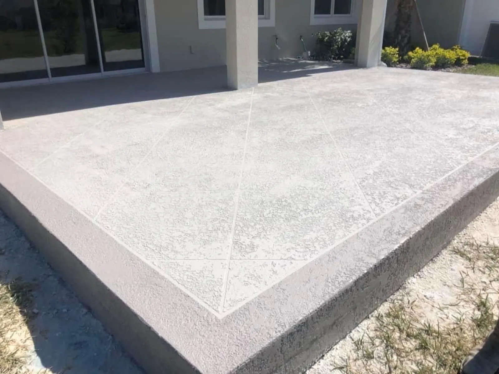 Concrete slab under a covered patio