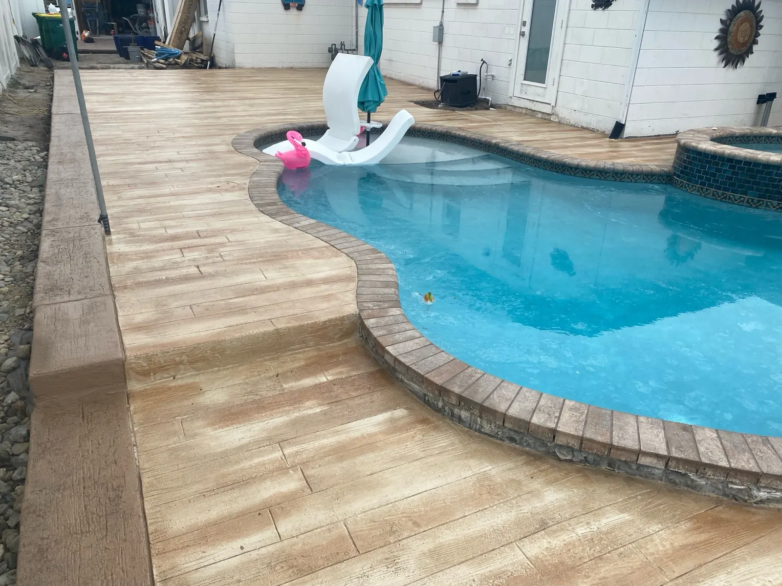 Stamped concrete pool deck in Palm Bay, FL by Hardscapes of Brevard