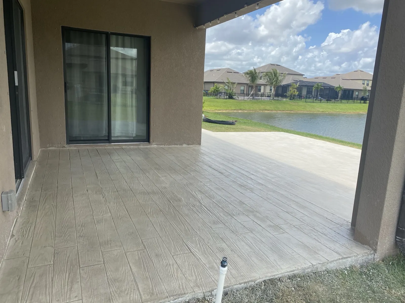 Wood look stamped concrete overlay on a lanai